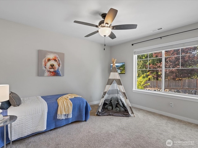 bedroom featuring baseboards, carpet flooring, and a ceiling fan