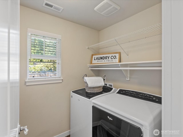 laundry room with washer and dryer