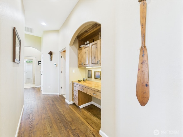 8144 Todderjen Ln SW, Olympia, WA 98512 - hallway with arched walkways, dark wood-style flooring, baseboards, and recessed lighting