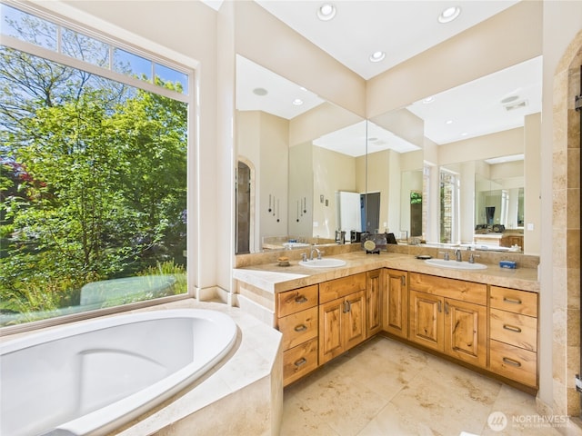 8144 Todderjen Ln SW, Olympia, WA 98512 - bathroom with a bath, double vanity, and recessed lighting
