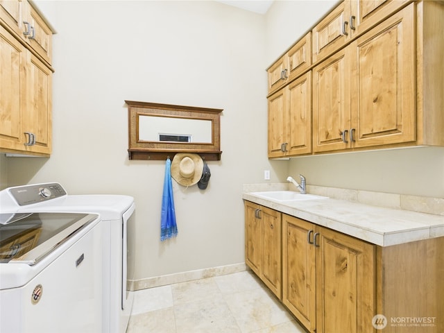 8144 Todderjen Ln SW, Olympia, WA 98512 - clothes washing area with washer and clothes dryer, cabinet space, baseboards, and light tile patterned flooring