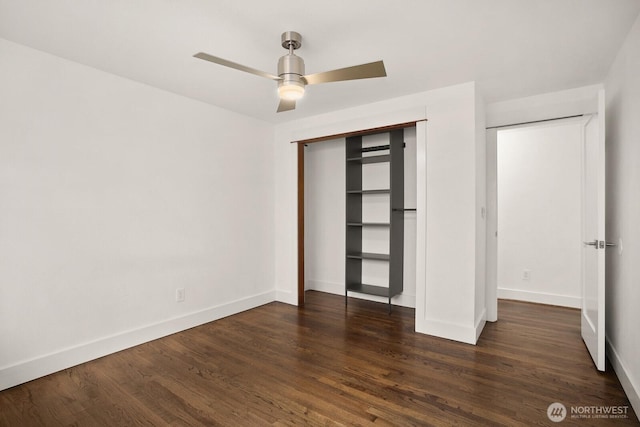 unfurnished bedroom with baseboards, dark wood-style floors, a closet, and ceiling fan