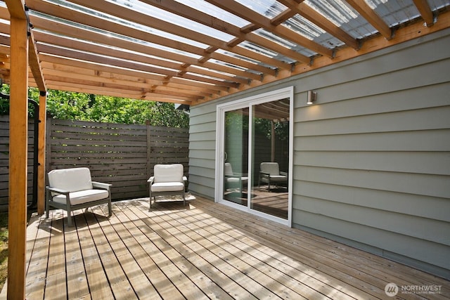 deck with a pergola and fence