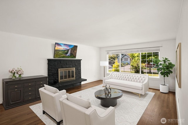 8826 10th Ave SW, Seattle, WA 98106 - living room with dark wood-style flooring, a glass covered fireplace, and baseboards