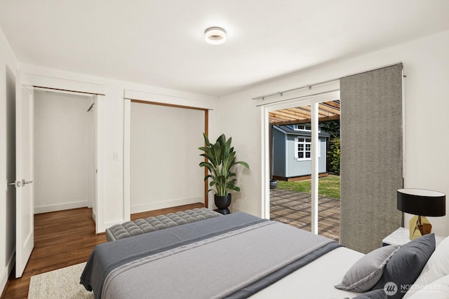 8826 10th Ave SW, Seattle, WA 98106 - bedroom featuring access to exterior, wood finished floors, and baseboards