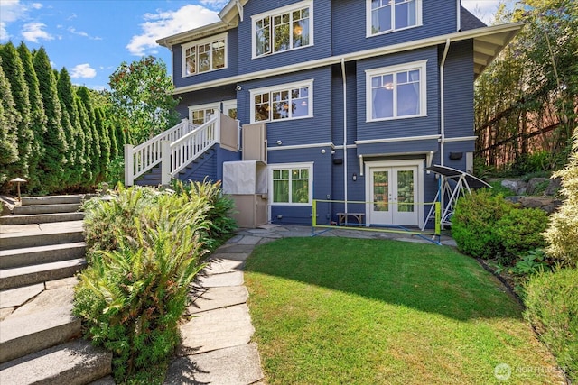 4504 37th Ave NE, Seattle, WA 98105 - view of front facade with stairs, french doors, and a front lawn