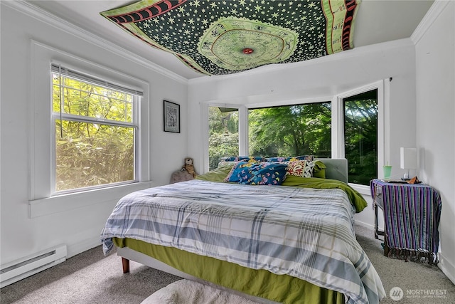 bedroom with a baseboard heating unit, carpet floors, and crown molding