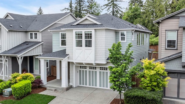 16533 White Mountain Rd SE, Monroe, WA 98272 - view of front facade featuring an attached garage, a shingled roof, and driveway