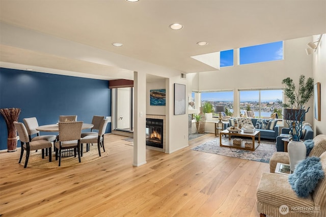 2400 Aurora Ave N Unit 202, Seattle, WA 98109 - living area featuring light wood-style floors, recessed lighting, and a tile fireplace