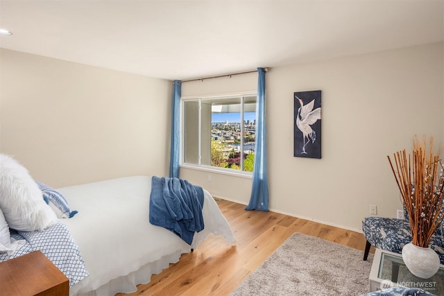 2400 Aurora Ave N Unit 202, Seattle, WA 98109 - bedroom featuring wood finished floors and baseboards