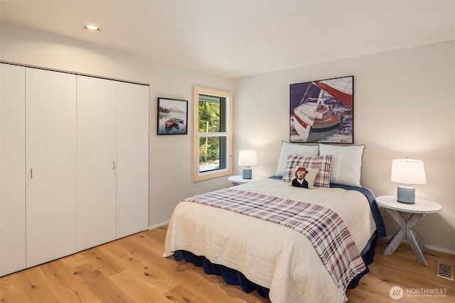 2400 Aurora Ave N Unit 202, Seattle, WA 98109 - bedroom with a closet, light wood-style floors, and recessed lighting
