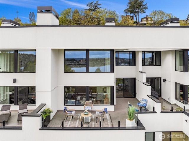 2400 Aurora Ave N Unit 202, Seattle, WA 98109 - rear view of property featuring a chimney
