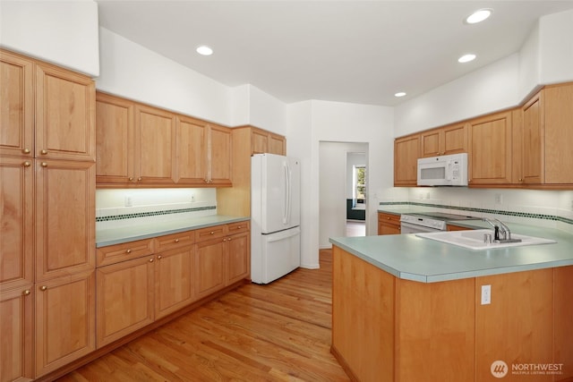 5007 70th Avenue Ct W Unit 7A, University Place, WA 98467 - kitchen with white appliances, light wood finished floors, light countertops, a peninsula, and recessed lighting