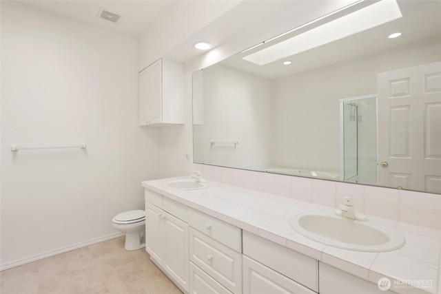 5007 70th Avenue Ct W Unit 7A, University Place, WA 98467 - bathroom with double vanity, toilet, a shower stall, a bath, and baseboards