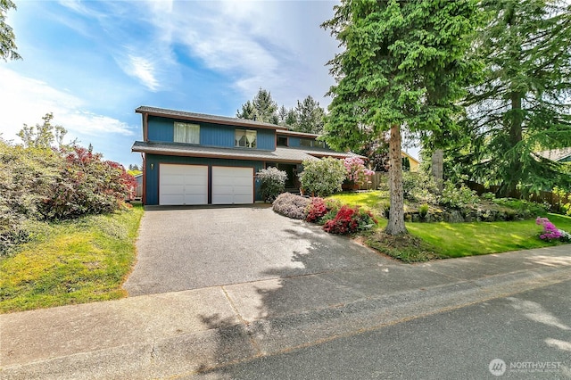 15915 SE 166th Pl, Renton, WA 98058 - traditional-style house featuring asphalt driveway, an attached garage, and a front yard