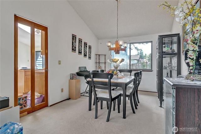 15915 SE 166th Pl, Renton, WA 98058 - dining room with vaulted ceiling, healthy amount of natural light, light colored carpet, a chandelier, and baseboards