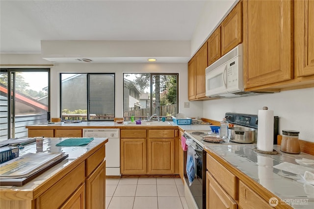 15915 SE 166th Pl, Renton, WA 98058 - kitchen featuring white appliances, a sink, light tile patterned floors, and tile counters