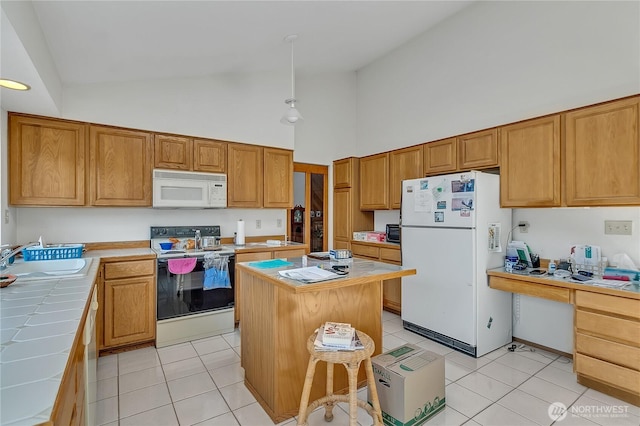 15915 SE 166th Pl, Renton, WA 98058 - kitchen featuring white appliances, tile counters, a sink, high vaulted ceiling, and light tile patterned floors