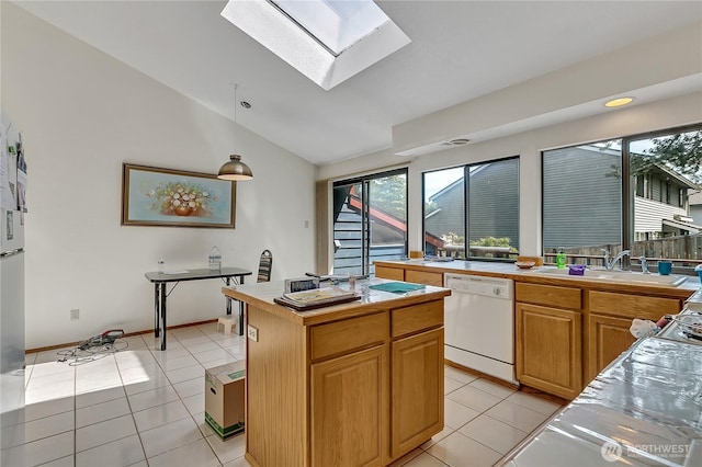 15915 SE 166th Pl, Renton, WA 98058 - kitchen featuring dishwasher, a sink, lofted ceiling, a skylight, and light tile patterned floors