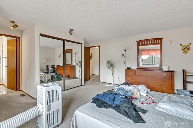 15915 SE 166th Pl, Renton, WA 98058 - carpeted bedroom with a textured ceiling and a closet