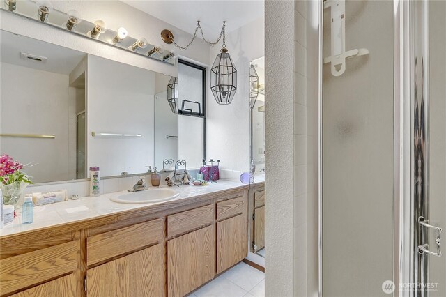 15915 SE 166th Pl, Renton, WA 98058 - bathroom featuring a shower stall, vanity, and tile patterned flooring
