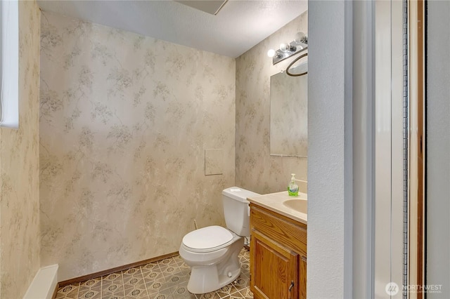 15915 SE 166th Pl, Renton, WA 98058 - bathroom with toilet, vanity, and baseboards