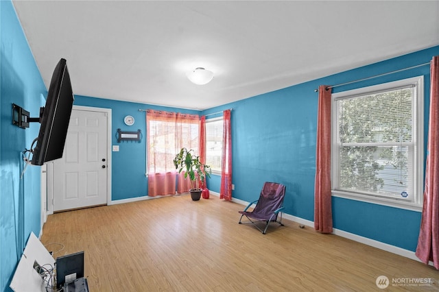 entrance foyer with wood finished floors and baseboards