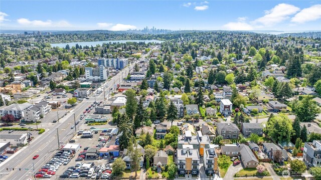 aerial overview of property's location with a nearby body of water and nearby urban area