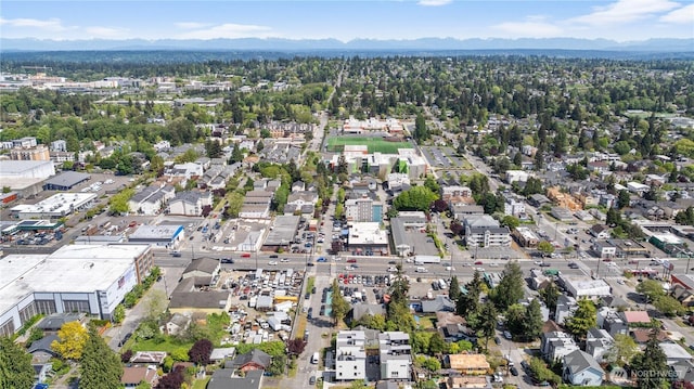 aerial view of property's location featuring mountains