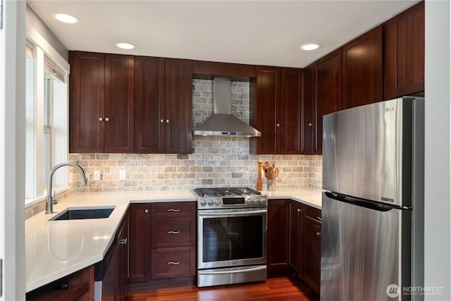 1503 Z St, Port Townsend, WA 98368 - kitchen featuring appliances with stainless steel finishes, wall chimney exhaust hood, a sink, light countertops, and recessed lighting