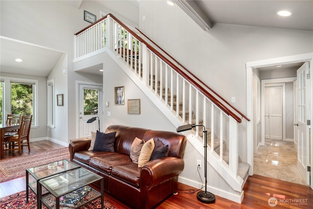 1503 Z St, Port Townsend, WA 98368 - living area featuring stairway, wood finished floors, baseboards, recessed lighting, and high vaulted ceiling