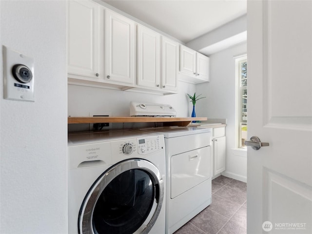 22431 82nd Ave W, Edmonds, WA 98026 - laundry room featuring separate washer and dryer, light tile patterned flooring, cabinet space, and baseboards