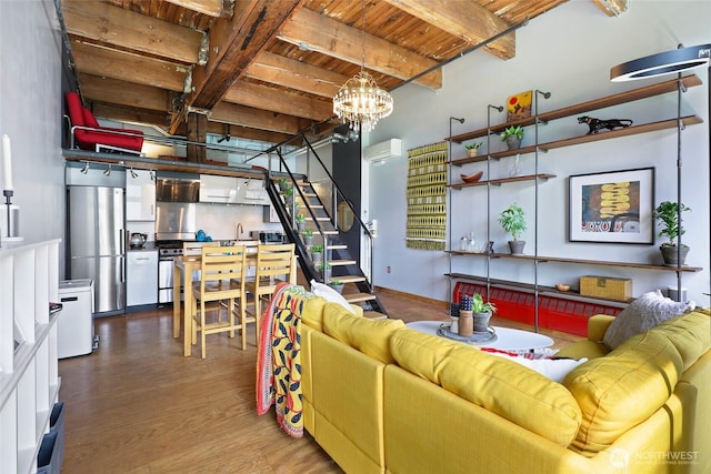 living room featuring wood ceiling, beam ceiling, dark wood-type flooring, stairs, and a chandelier