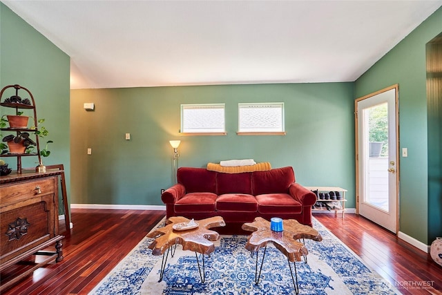 living room with wood-type flooring and baseboards