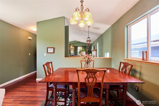 dining space with a chandelier, wood finished floors, plenty of natural light, and baseboards
