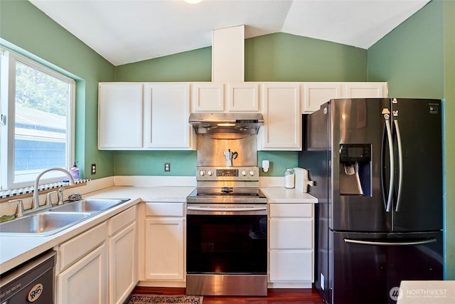 kitchen featuring stainless steel appliances, under cabinet range hood, a sink, lofted ceiling, and light countertops