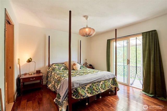 bedroom featuring access to outside and hardwood / wood-style floors