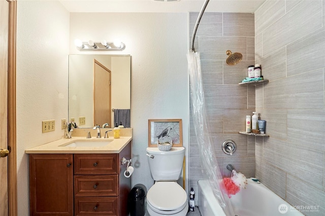 bathroom featuring shower / bathtub combination with curtain, vanity, and toilet