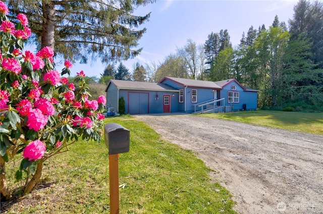1510 144th Ln, Long Beach, WA 98631 - view of front of property featuring driveway, an attached garage, and a front lawn