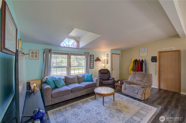1510 144th Ln, Long Beach, WA 98631 - living area featuring dark wood-style flooring and vaulted ceiling