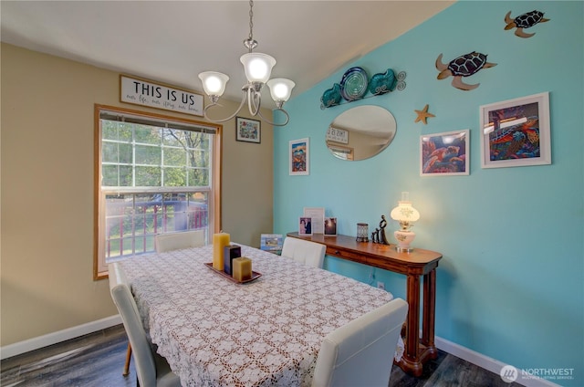 1510 144th Ln, Long Beach, WA 98631 - dining room featuring baseboards, dark wood finished floors, and a chandelier
