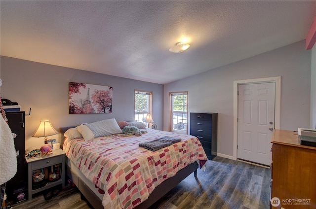 1510 144th Ln, Long Beach, WA 98631 - bedroom with lofted ceiling, dark wood-style floors, baseboards, and a textured ceiling
