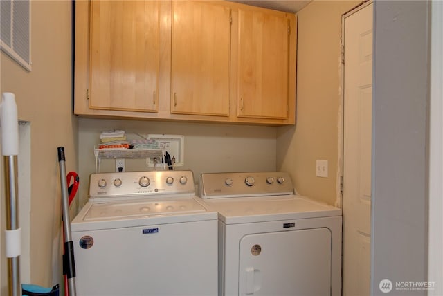 1510 144th Ln, Long Beach, WA 98631 - clothes washing area with washer and clothes dryer and cabinet space