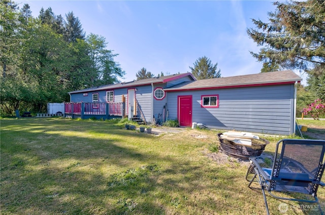 1510 144th Ln, Long Beach, WA 98631 - rear view of property with a wooden deck and a yard