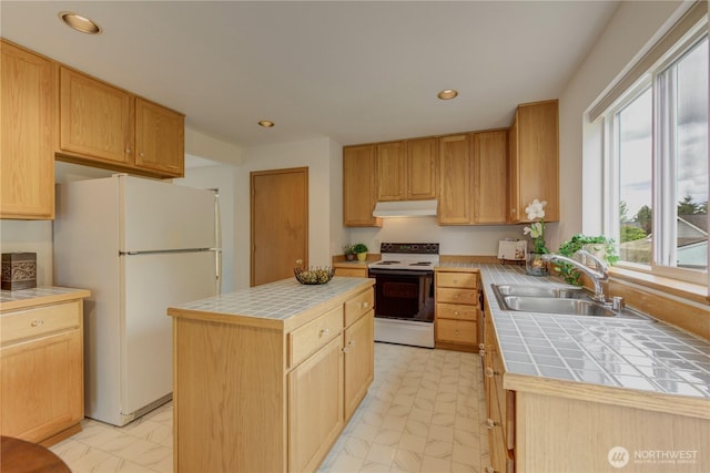 5511 152nd St SE, Everett, WA 98208 - kitchen featuring range with electric stovetop, under cabinet range hood, tile countertops, freestanding refrigerator, and recessed lighting
