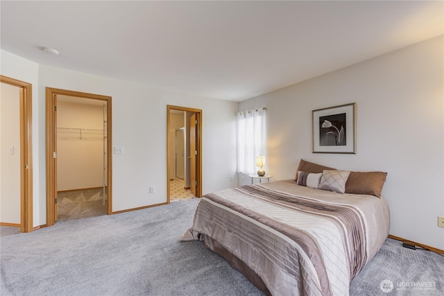 5511 152nd St SE, Everett, WA 98208 - carpeted bedroom featuring a spacious closet, baseboards, ensuite bathroom, and a closet