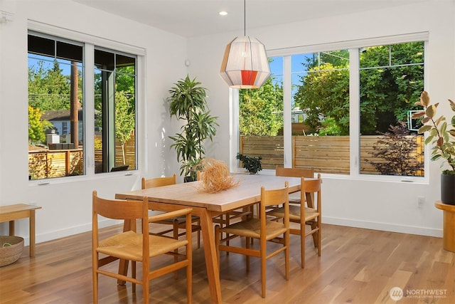 10419 41st Ave SW Unit A, Seattle, WA 98146 - dining area with light wood finished floors, baseboards, and recessed lighting