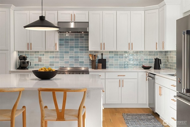 10419 41st Ave SW Unit A, Seattle, WA 98146 - kitchen with white cabinets, light countertops, and a breakfast bar