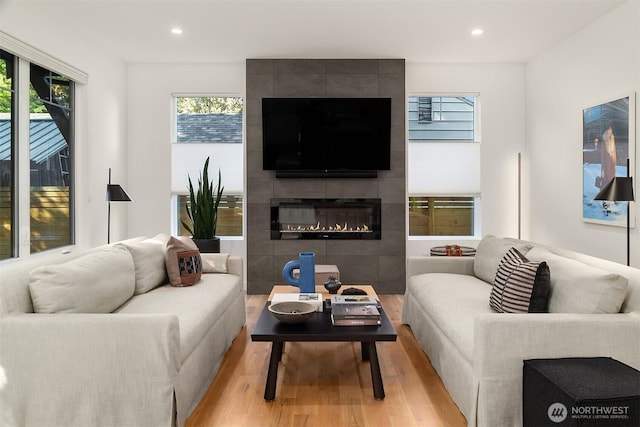 10419 41st Ave SW Unit A, Seattle, WA 98146 - living area featuring light wood-style floors, a fireplace, and recessed lighting