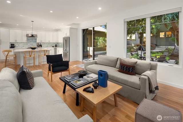 10419 41st Ave SW Unit A, Seattle, WA 98146 - living room featuring light wood-style floors and recessed lighting